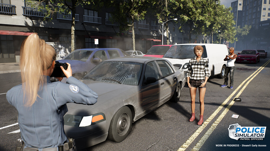 A policewoman records an accident by taking photos at the accident site. 